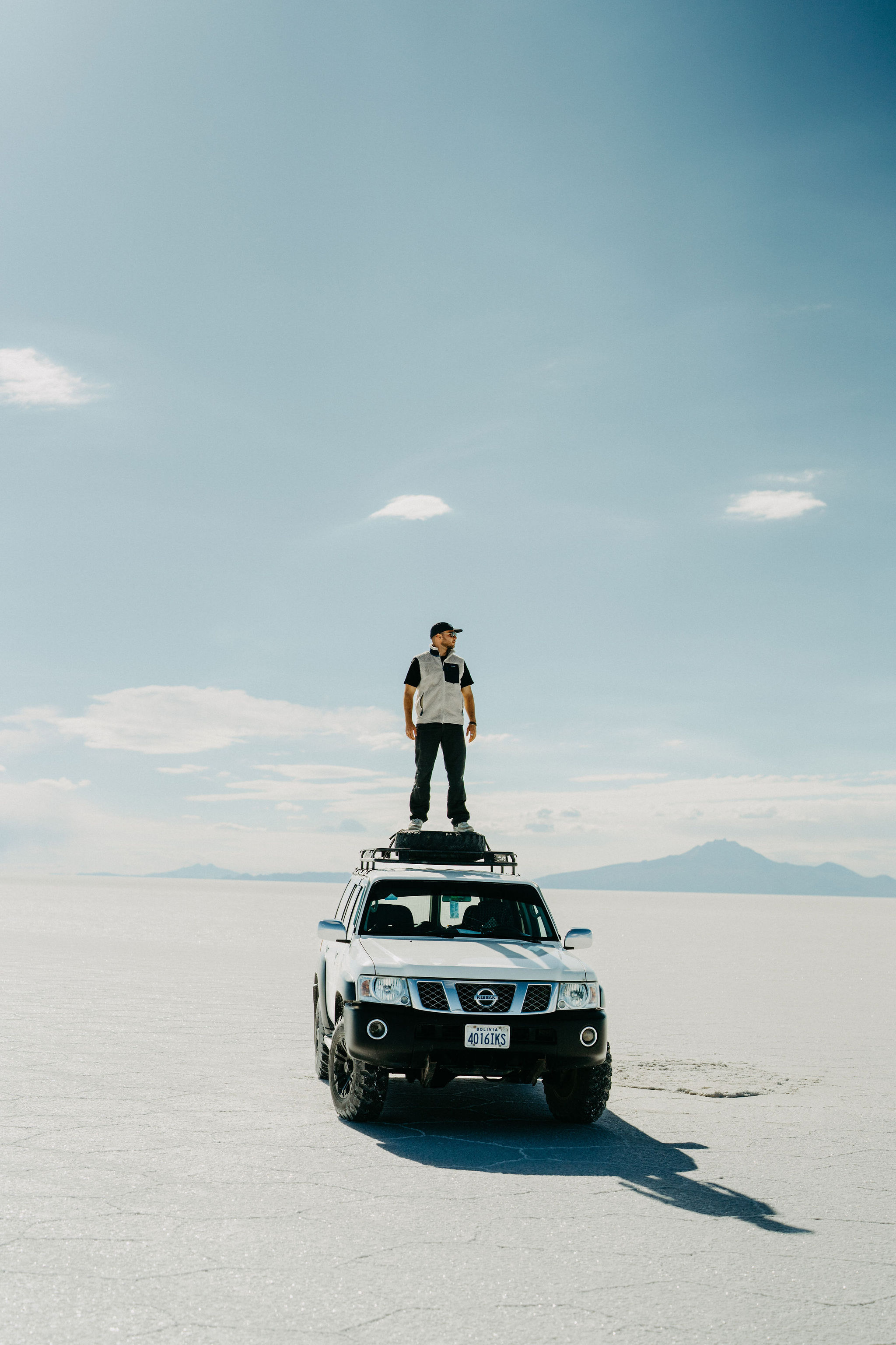 Jeep parked on the empty Altiplano during the crossing