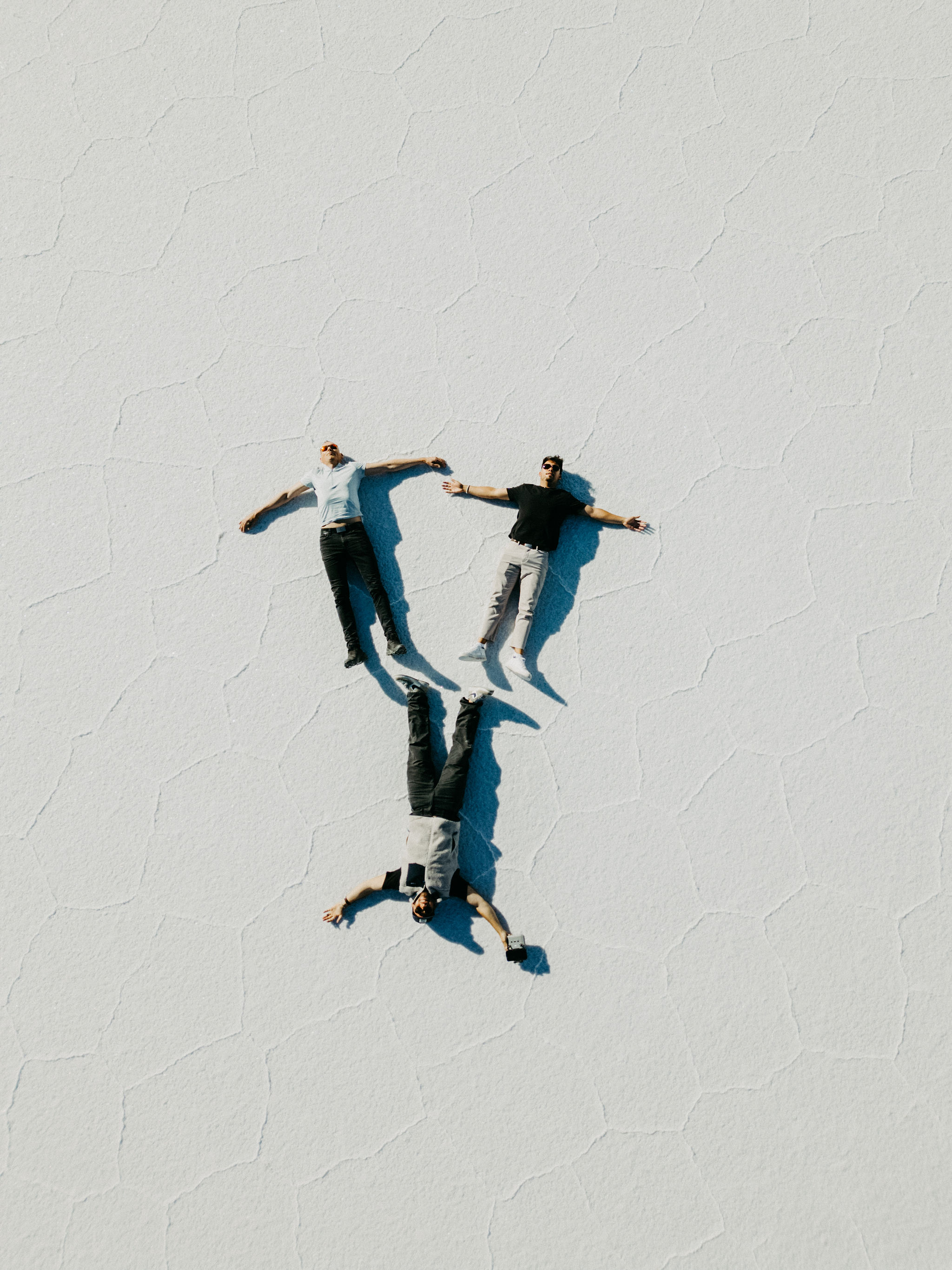 Lying on the cracked white surface of the Uyuni salt flat