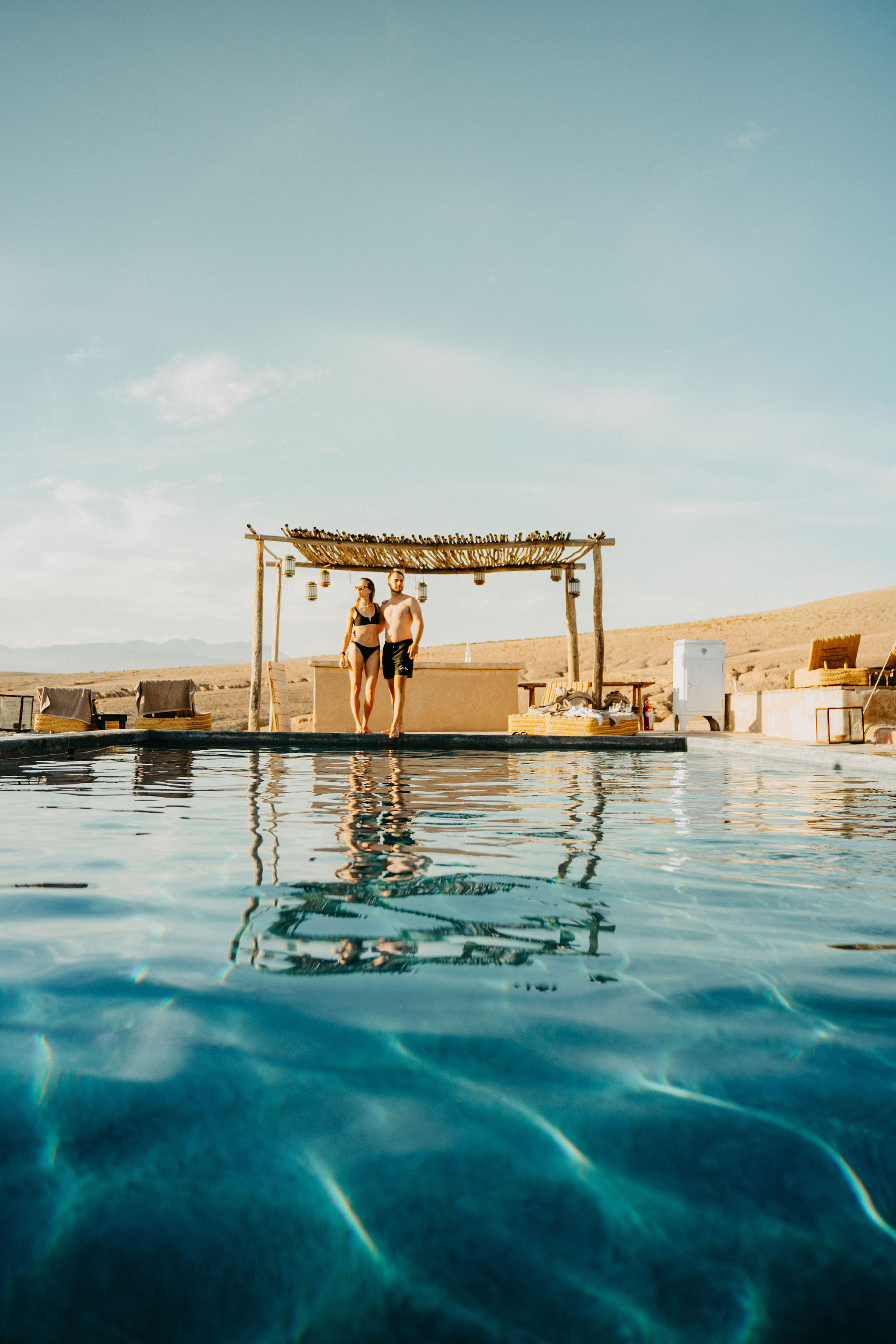 Pool at a desert camp looking out over the stone desert