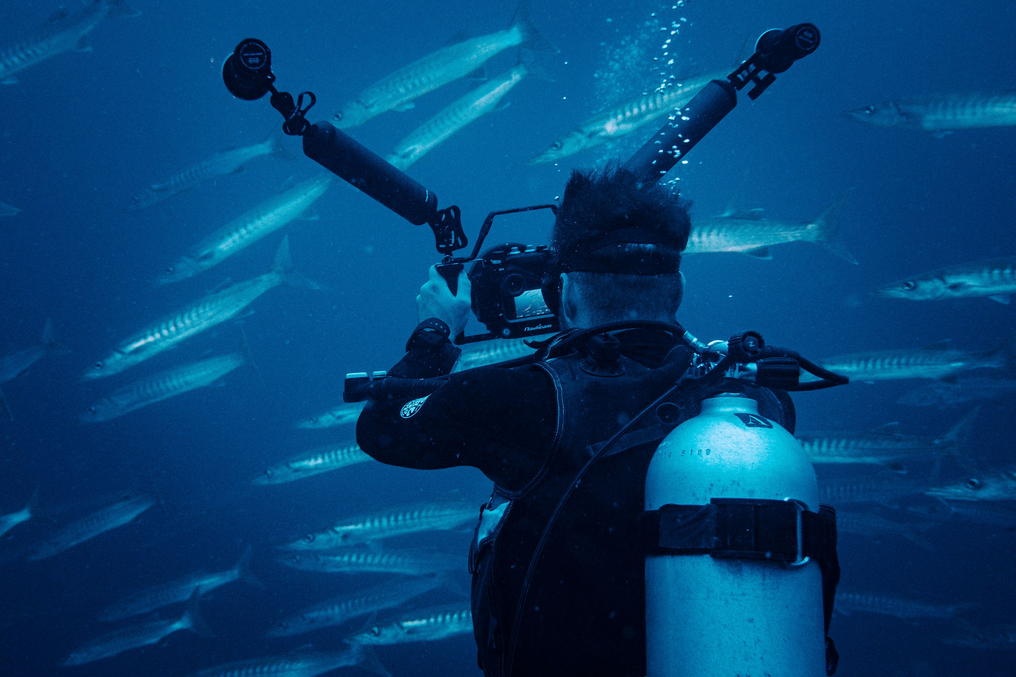 Ben Tischhauser filming underwater in Raja Ampat